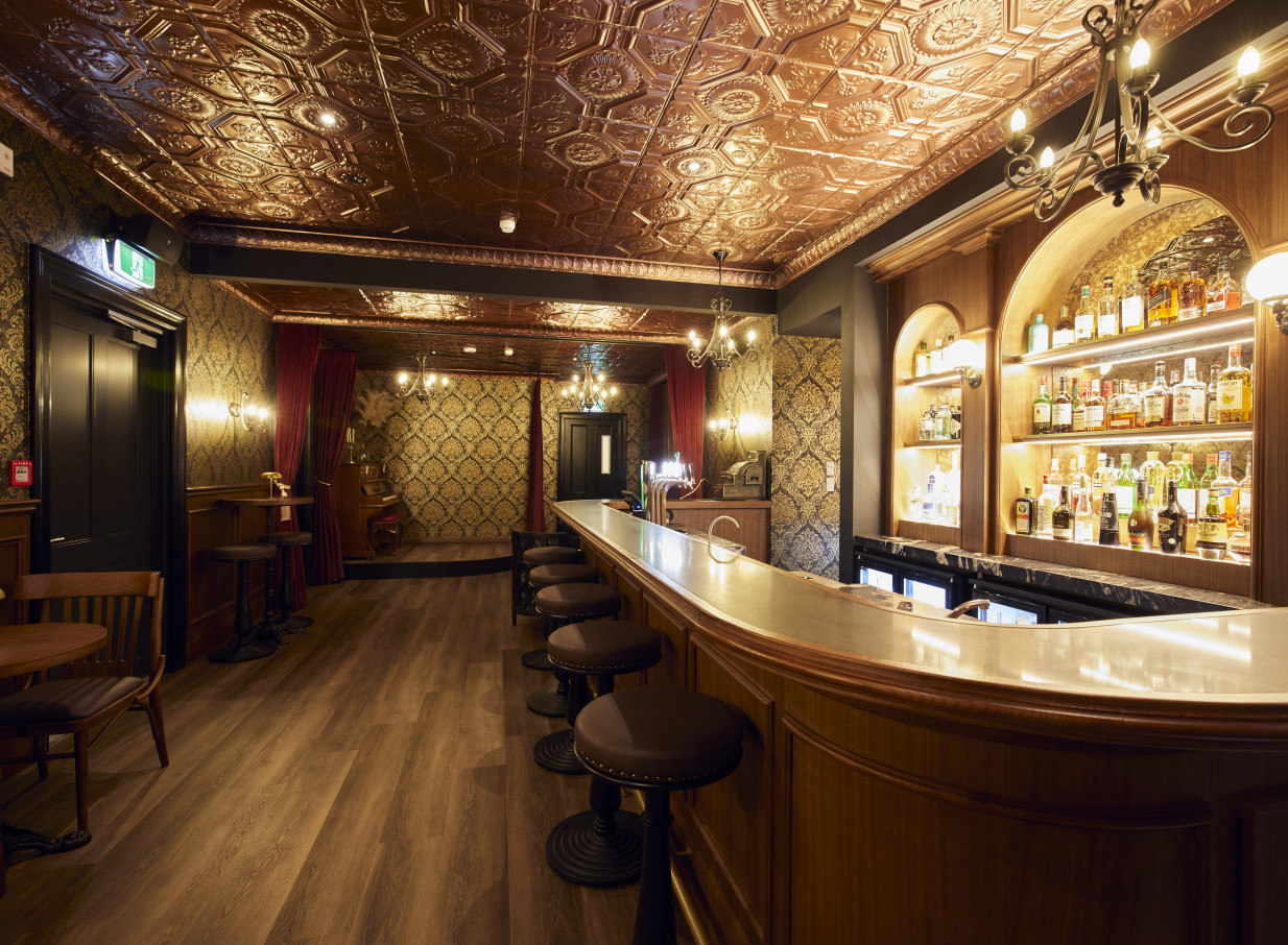 The Clements Hotel in Waikato features an opulent, prohibition-era inspired speakeasy bar with a pressed tin ceiling and ornate wallpaper.