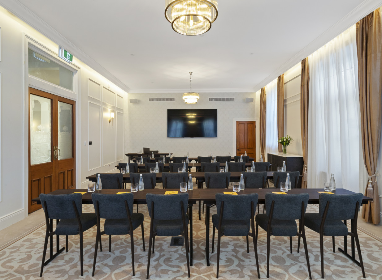 An elegant conference room in The Clements Hotel, Waikato, blending historic Beaux-Arts style with modern amenities.