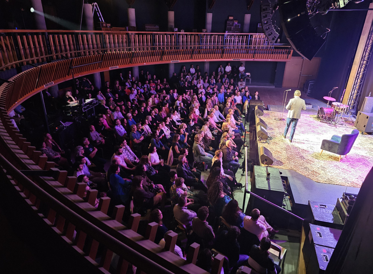 Audience seated in the modern Meow Nui music venue in Wellington, enjoying a performance from the mezzanine and main floor.