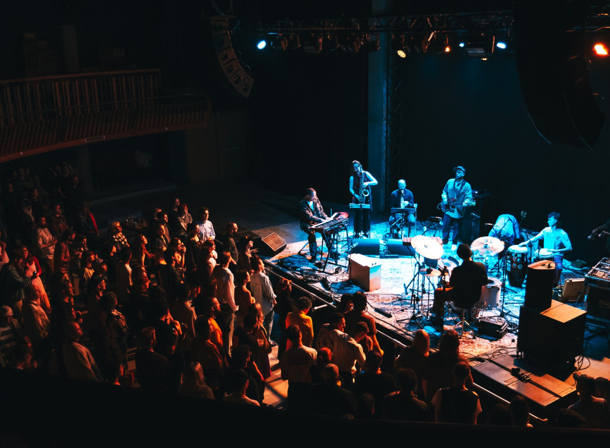A live band plays for an audience at Meow Nui, Wellington's premium music venue, housed in a refurbished church.