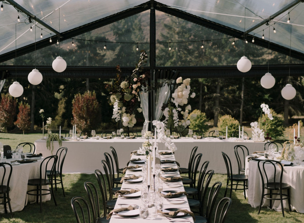 Dublin Bay Wanaka's elegant clear-top tent dining, framed by its breathtaking natural open-air setting.