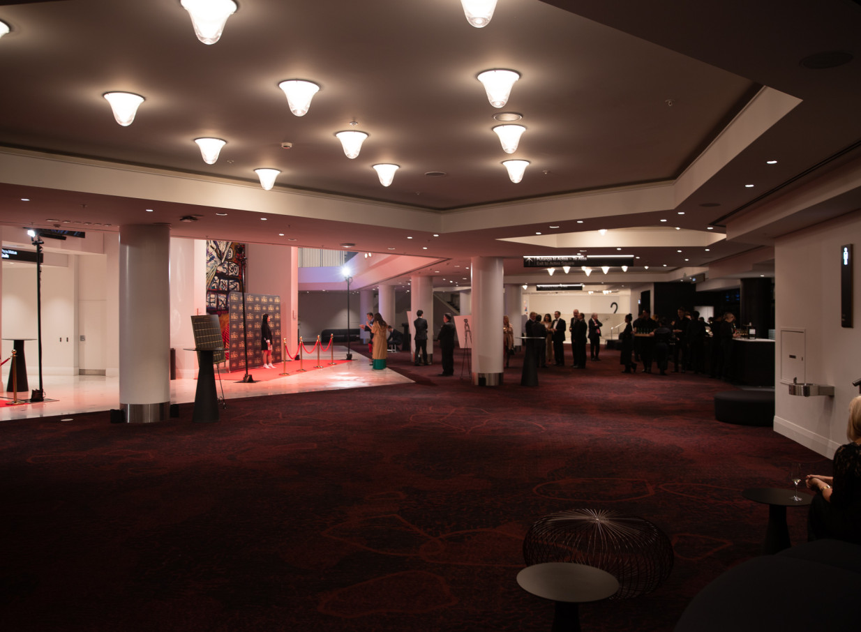 A spacious, modern event foyer featuring bespoke carpet and a red carpet entry at the Aotea Centre, Auckland.