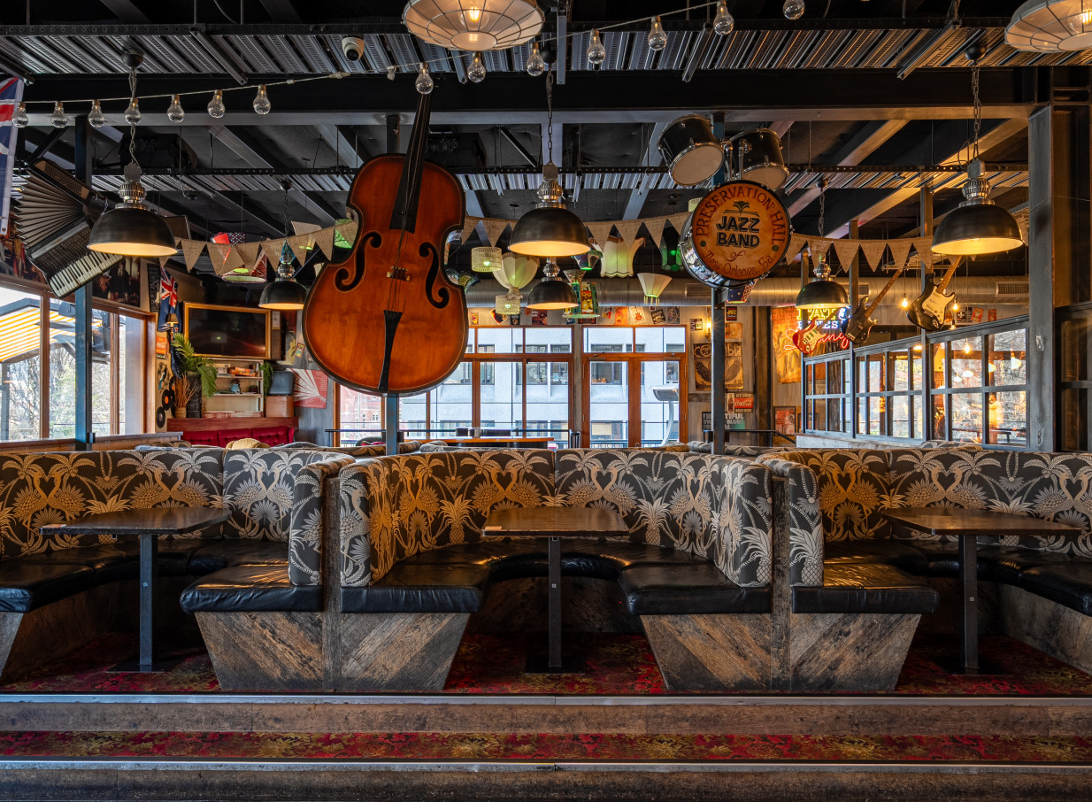 Fat Eddie's in Christchurch offers a vibrant, New Orleans-style jazz club dining area with eclectic musical decor and comfortable booth seating.