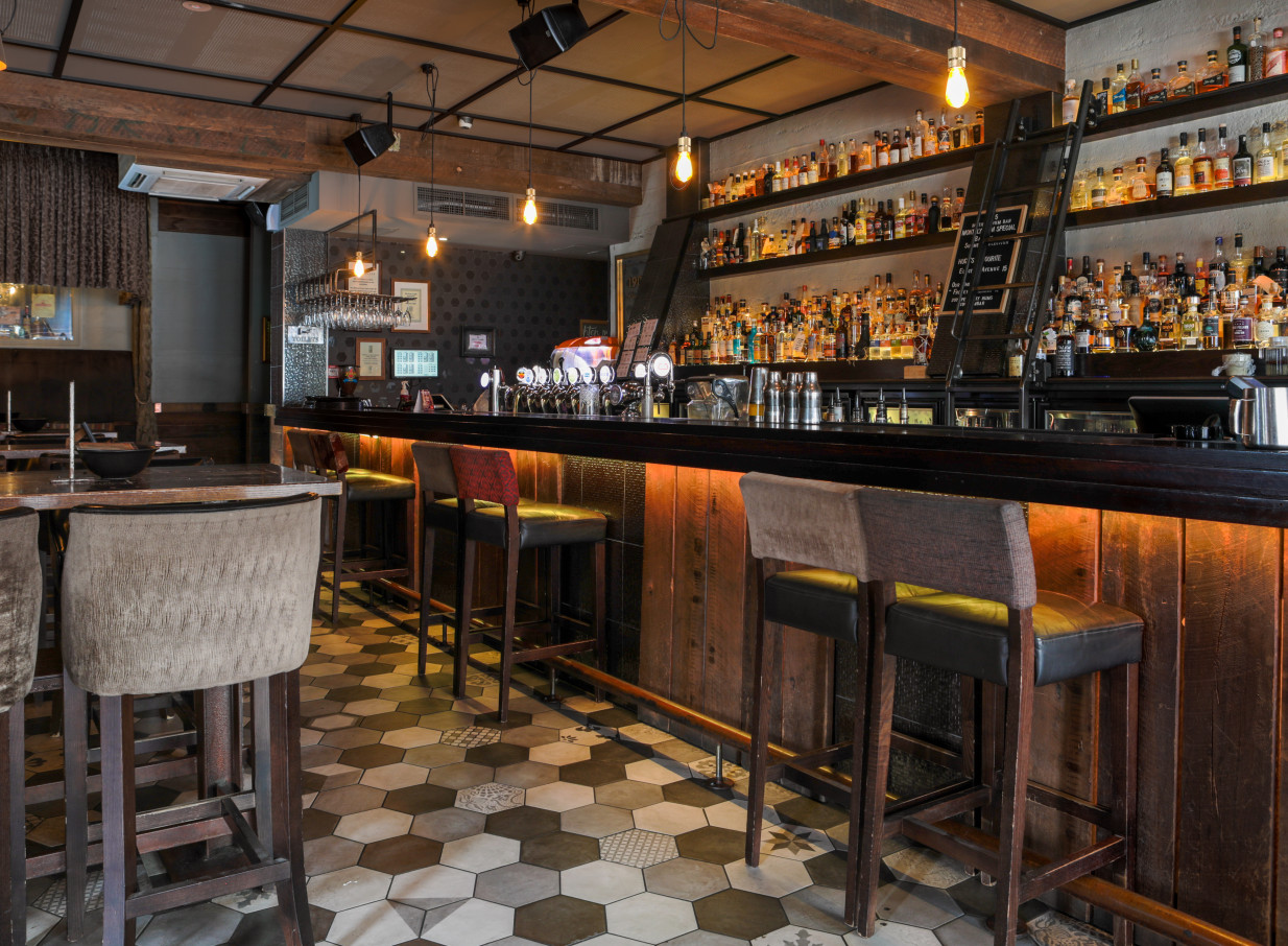 Casa Publica in Christchurch offers a moody, prohibition-era inspired bar with a vast rum selection and patterned tile floor.