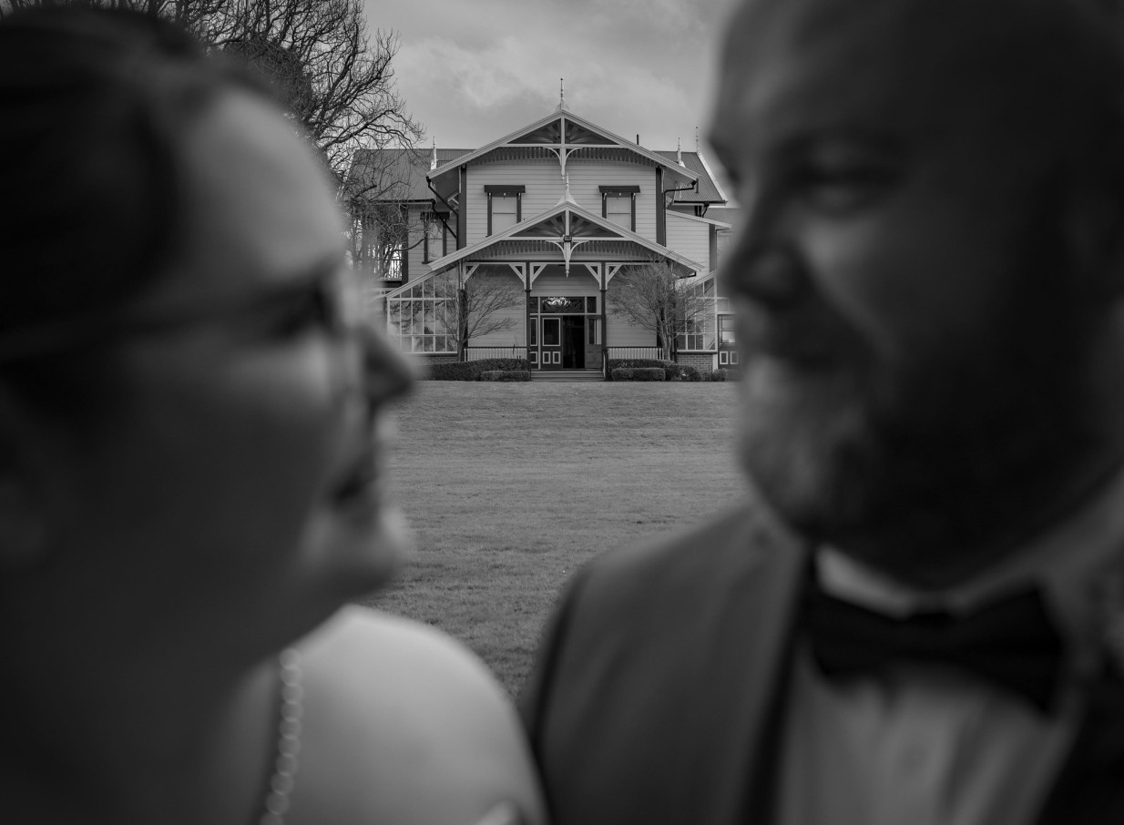 Historic Caccia Birch House, an elegant colonial homestead in Manawatū-Whanganui, viewed across its lawn.