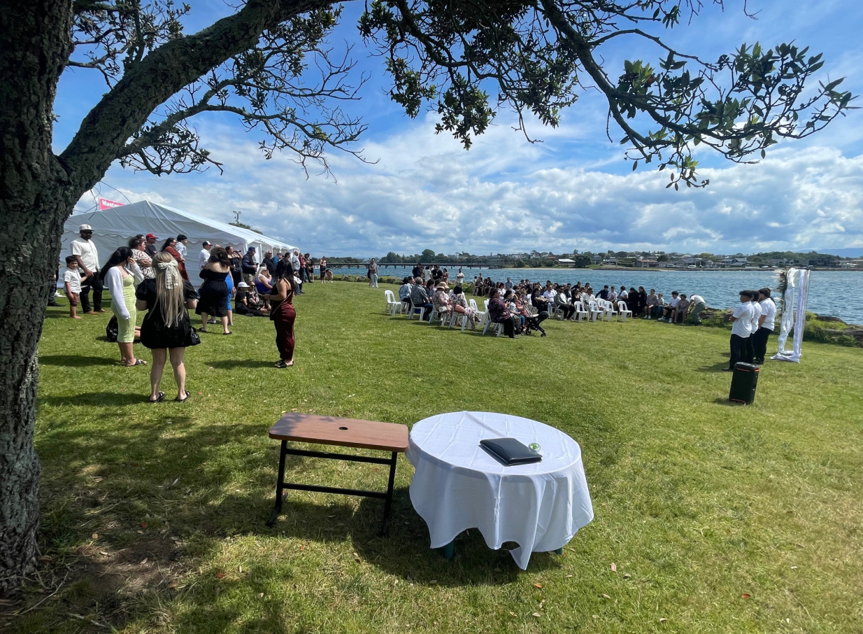An outdoor waterfront event at Tauranga Fish and Dive Club, offering a relaxed coastal setting with stunning harbour views.