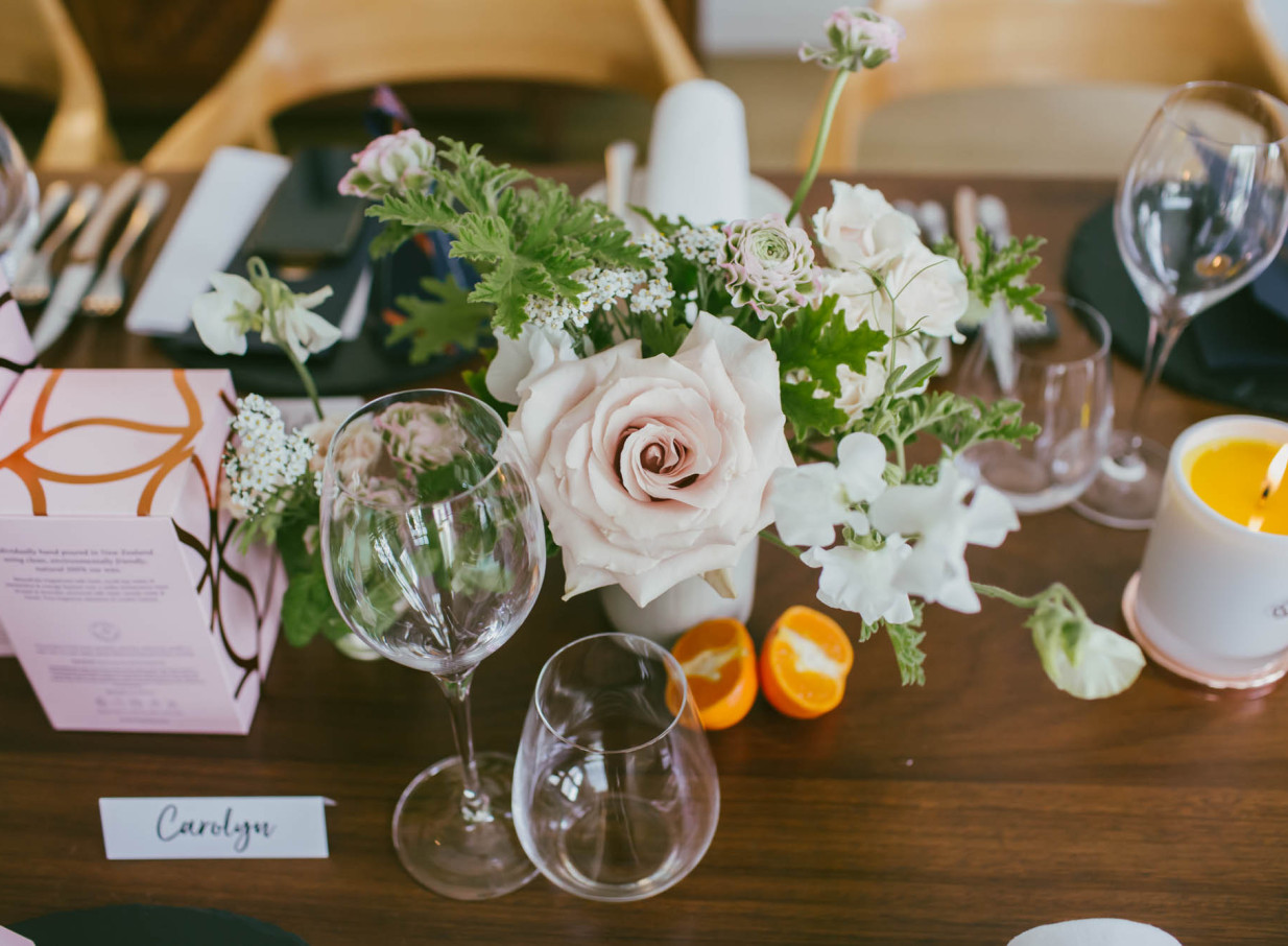 A chic table setting featuring a blush floral centerpiece at The French Cafe, renowned for its contemporary elegance in Auckland.