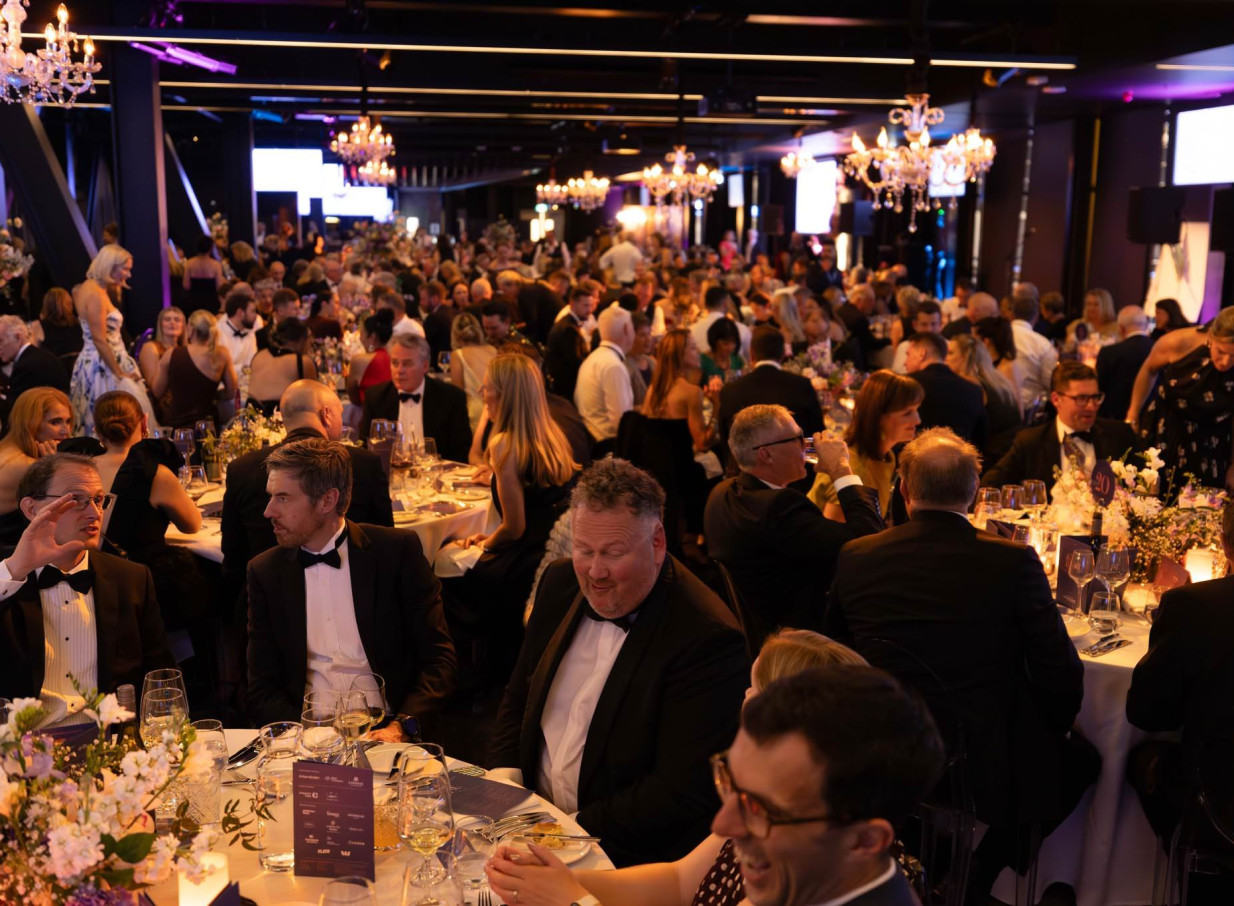 Guests attend a formal gala dinner in a modern event space at One New Zealand Stadium, Christchurch.