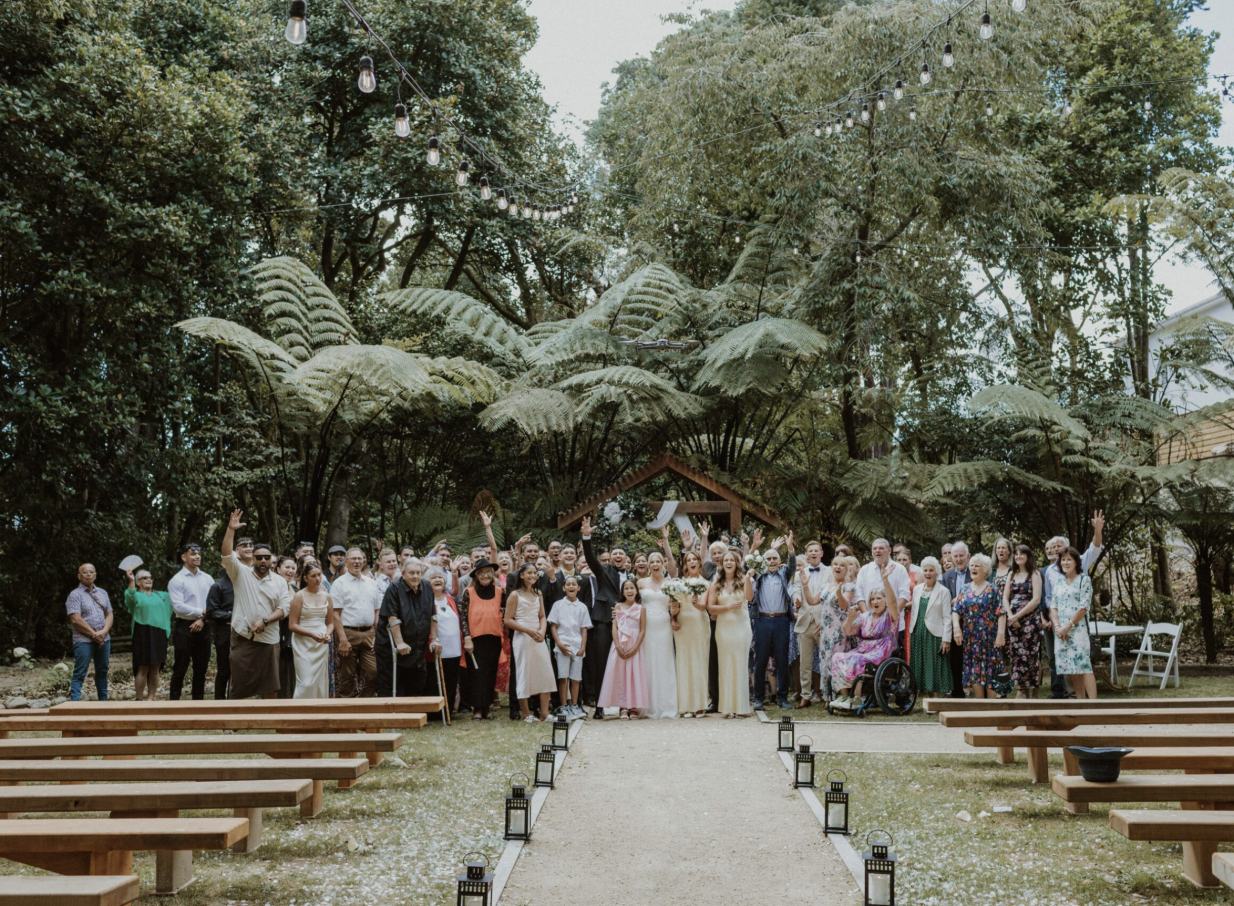 A joyful outdoor wedding celebration at Tatum, a heritage-rich parkland venue in Manawatū-Whanganui.