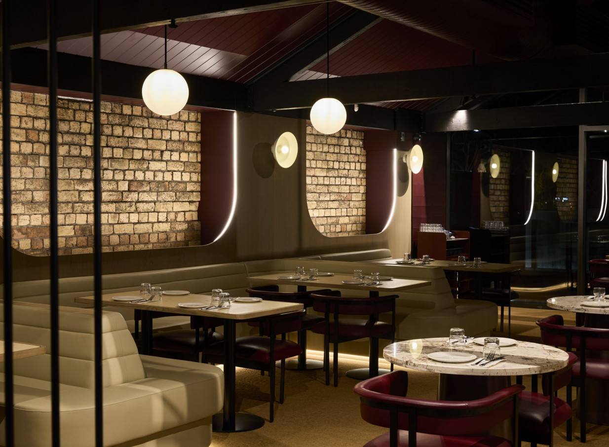 Brick walls and tables at Darling on Drake