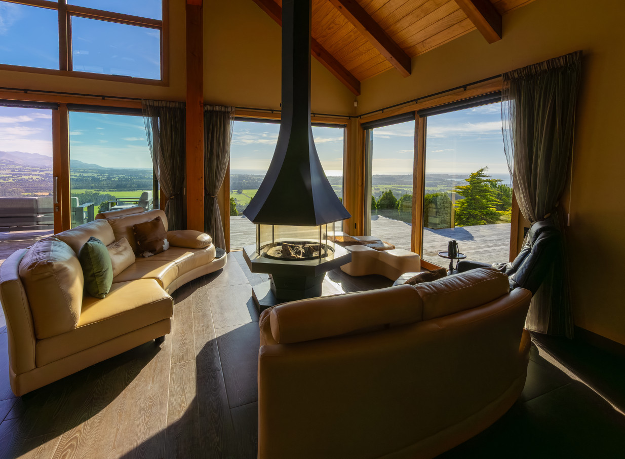 Lounge area with fireplace at Ata Rangi Lodge