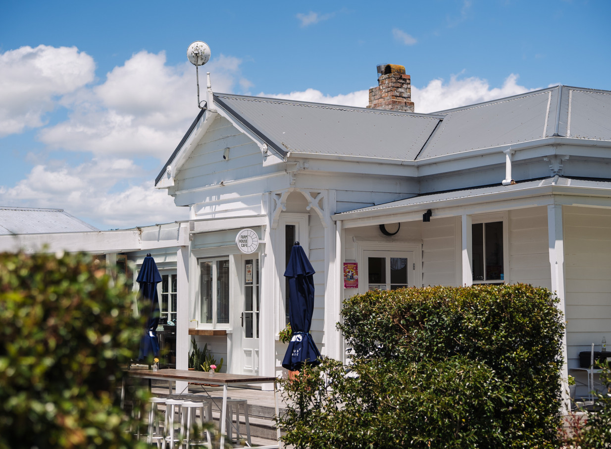 An outdoor dining area at Farm House Cafe, a charming heritage villa in Auckland.