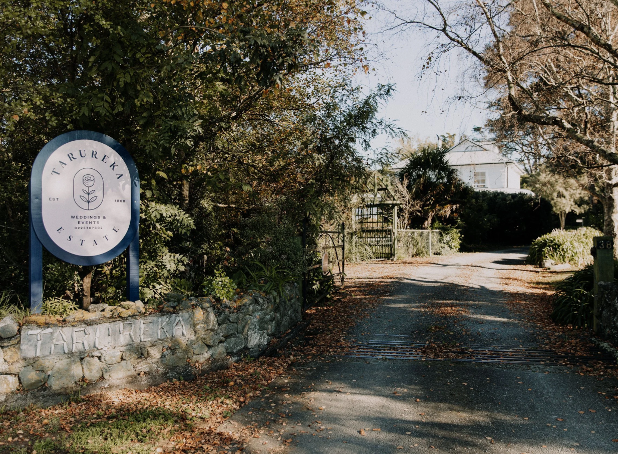 The verdant entrance to Tarureka Estate, a rustic and historic Wellington wedding venue with authentic charm.