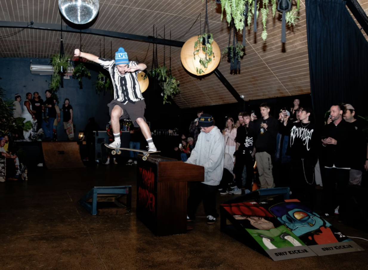 An indoor skateboarding event fills the moody, rustic, disco-infused space of Evil Genius in Christchurch.