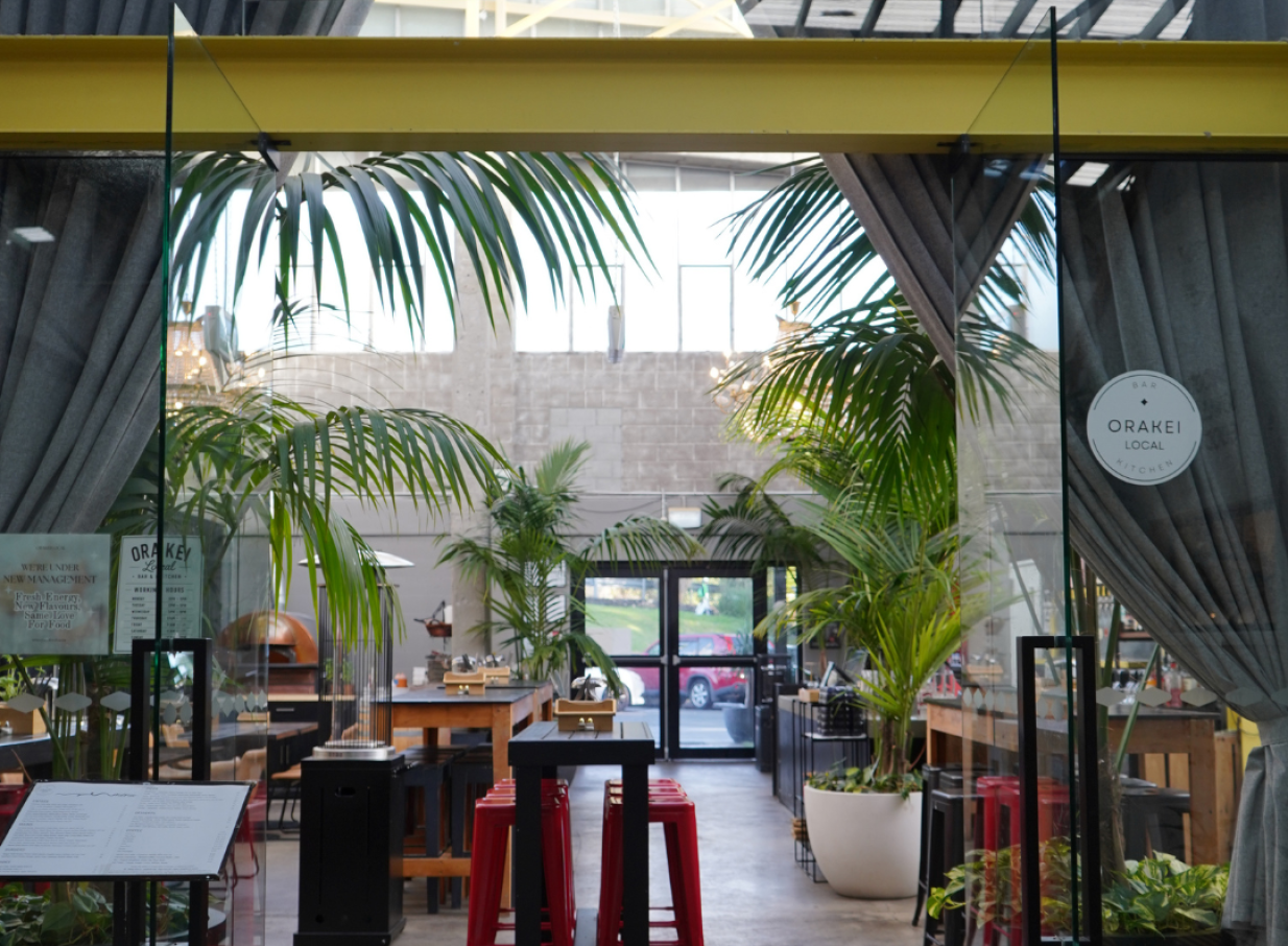 Orakei Local, Auckland offers a stylish, plant-filled modern bar and kitchen interior with a relaxed vibe.