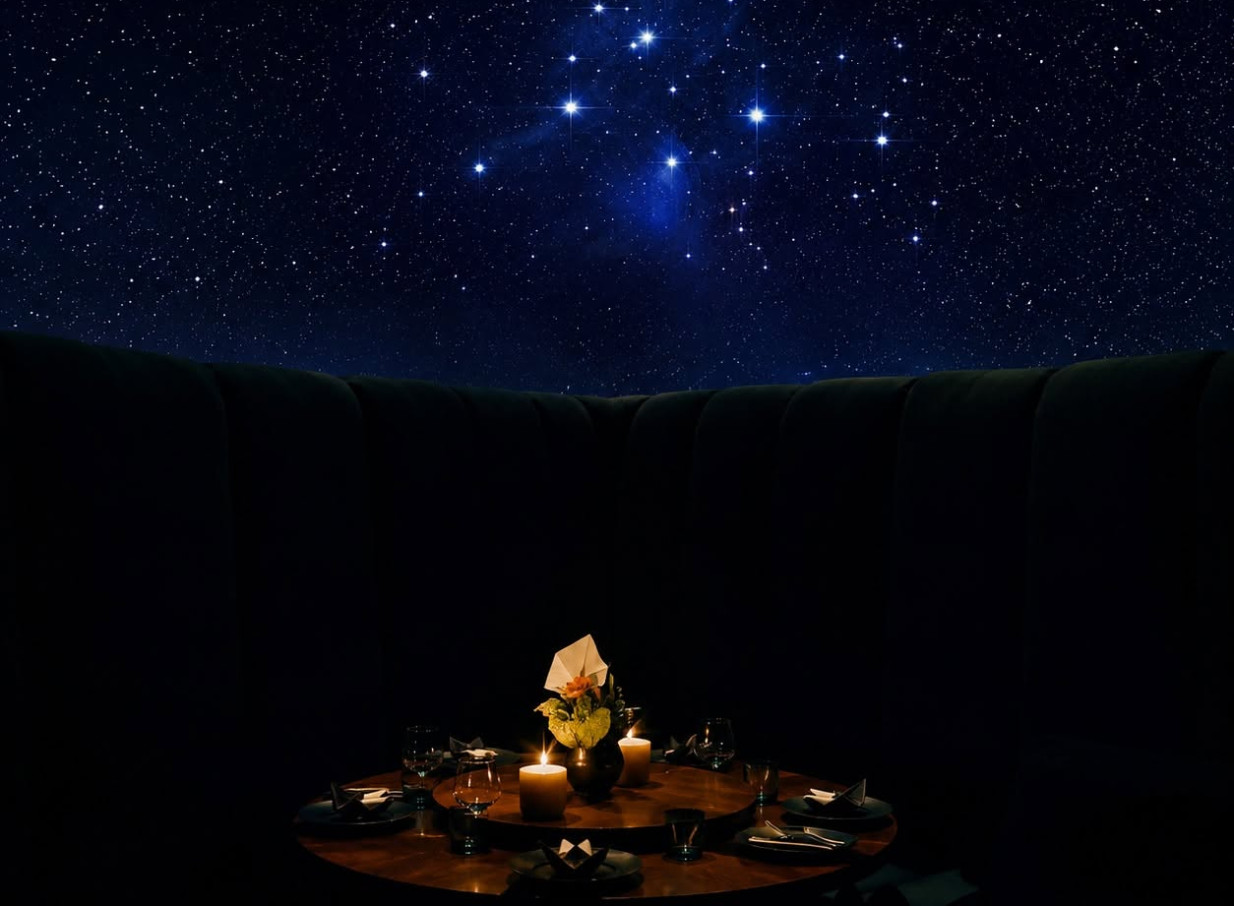 A sky-inspired, intimate dining setting with candles under the stars at Manu, Christchurch, embodying its Pacifica glam.