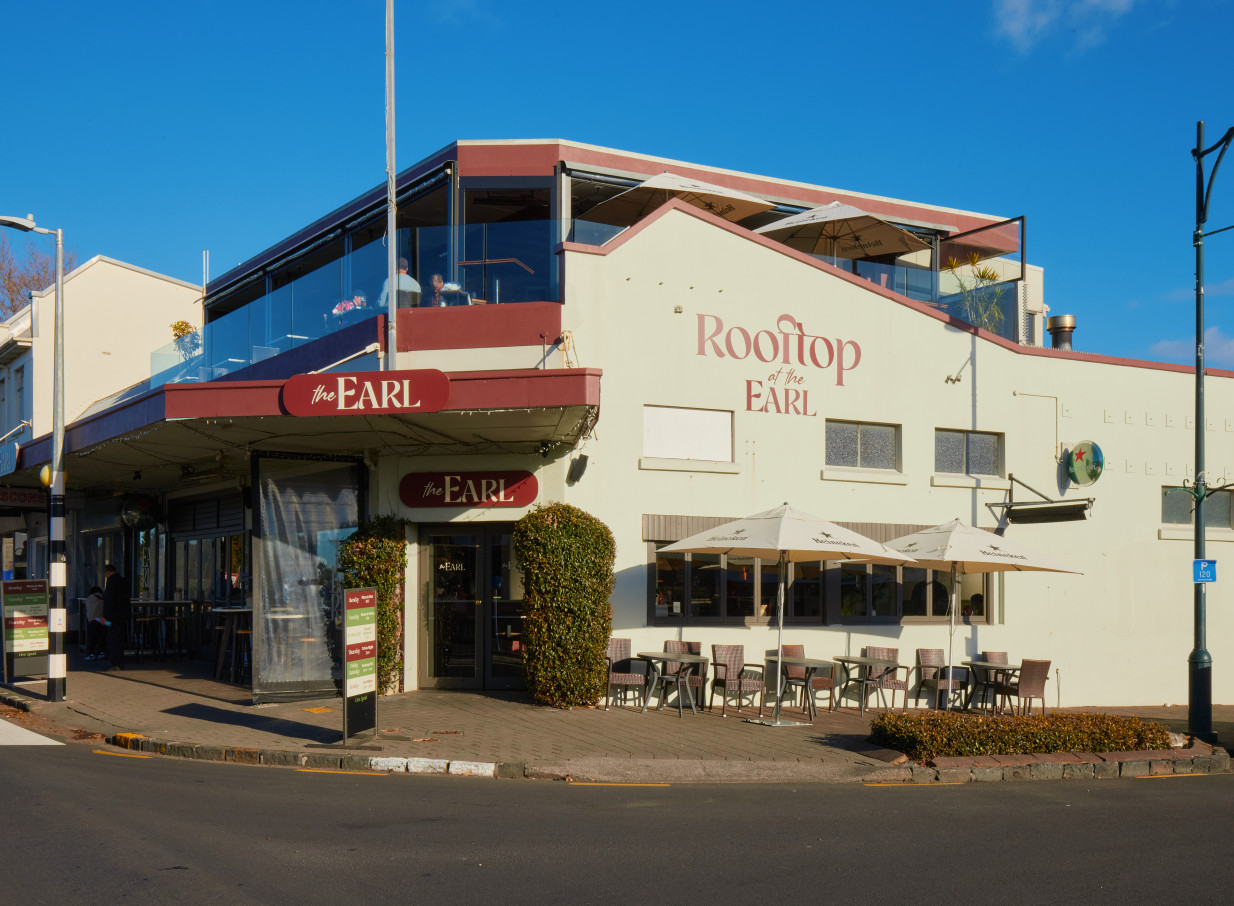The Earl in Auckland features a bright exterior with a ground-floor restaurant and a prominent rooftop dining area.