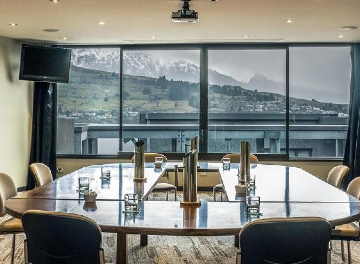 The Rees Hotel Queenstown offers an elegant conference room with panoramic alpine views.