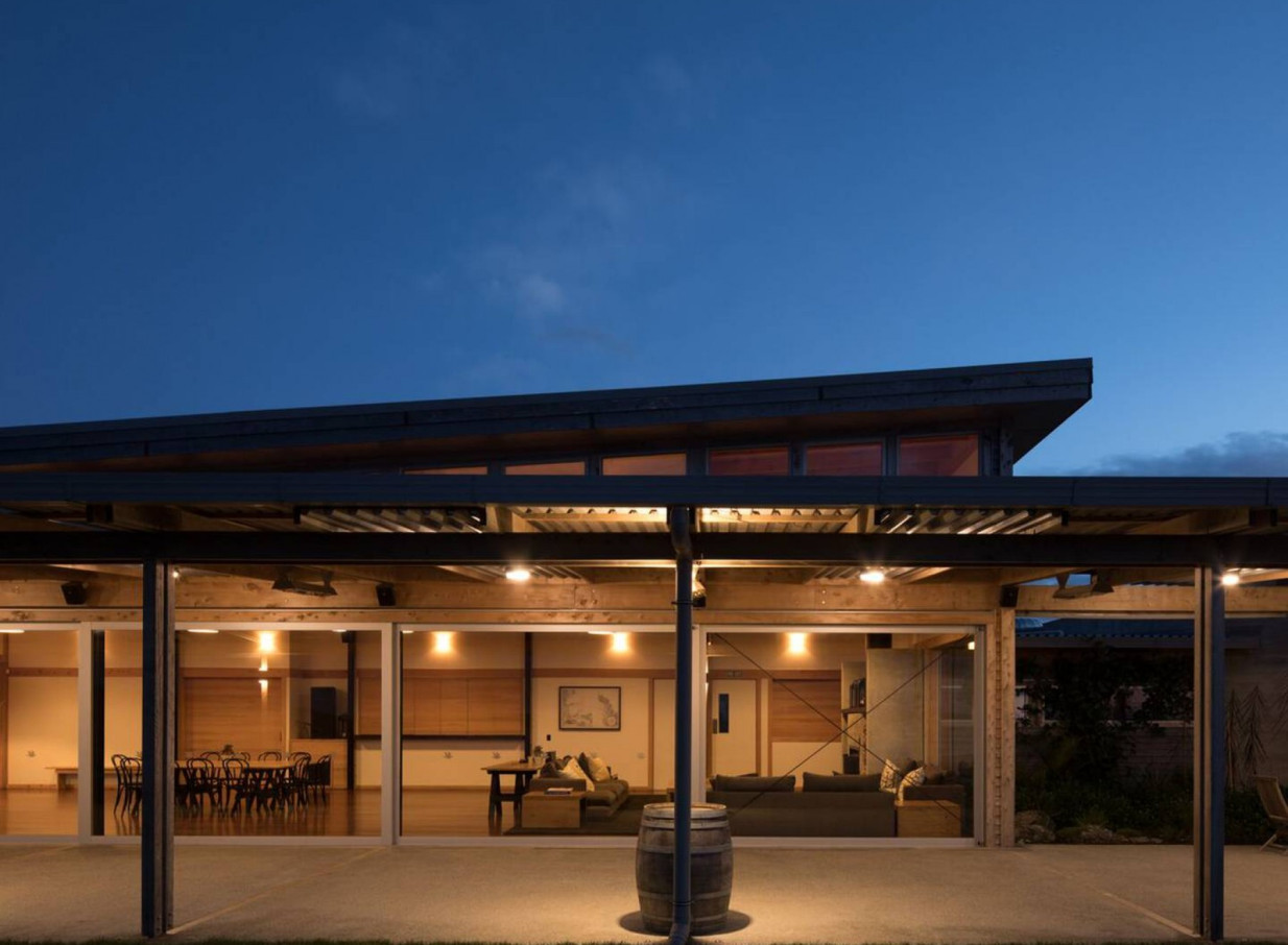 Kauri Bay, Auckland, offers an illuminated modern-rustic venue with inviting dining and lounge areas.