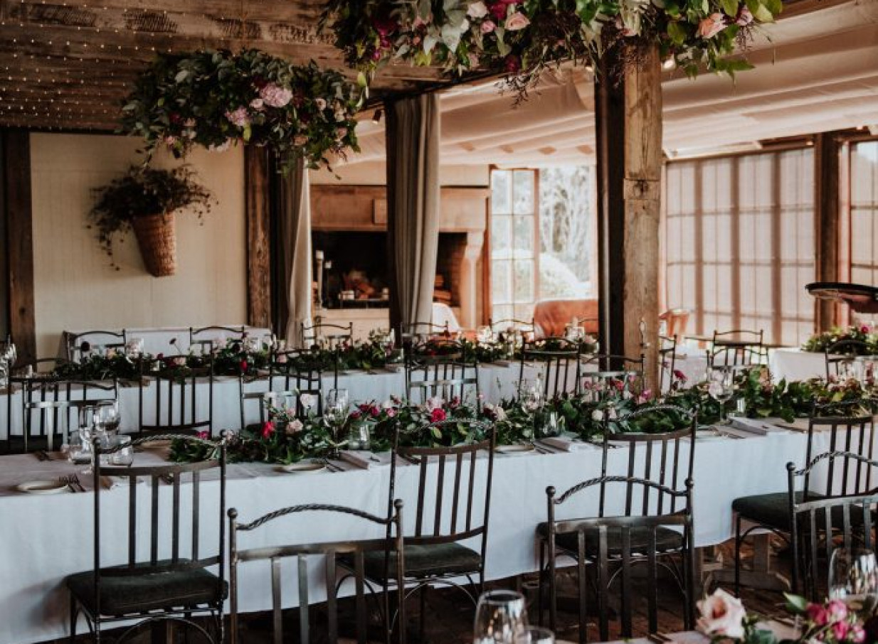 Mudbrick, Waiheke Island's elegant mudbrick dining room, beautifully adorned for a reception.