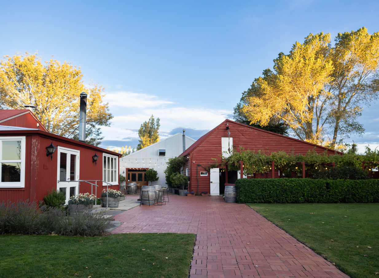 Larcomb Vineyard in Christchurch offers a rustic-chic outdoor event space between its notable red and white barns.