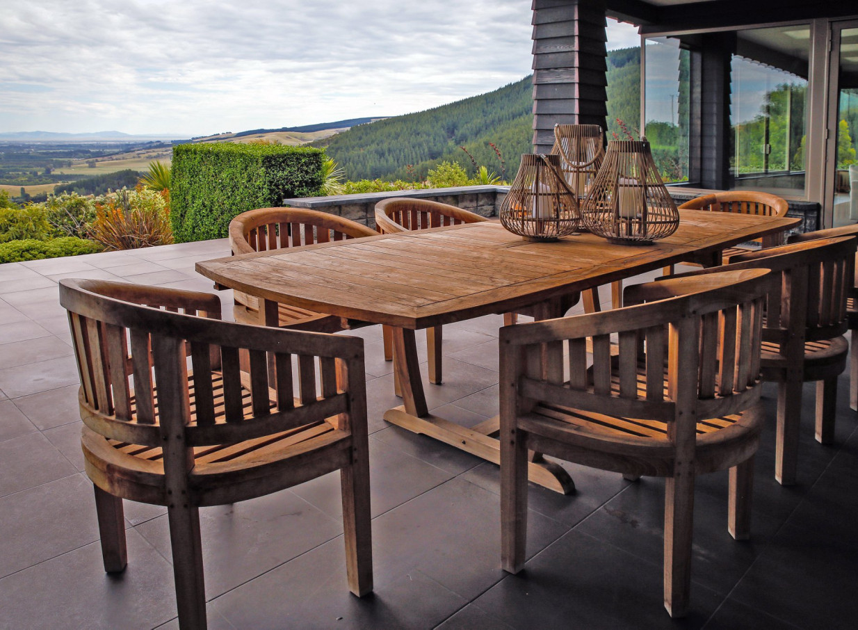 Waipuna Estate, Christchurch, features a modern outdoor dining terrace with panoramic views of the Southern Alps.