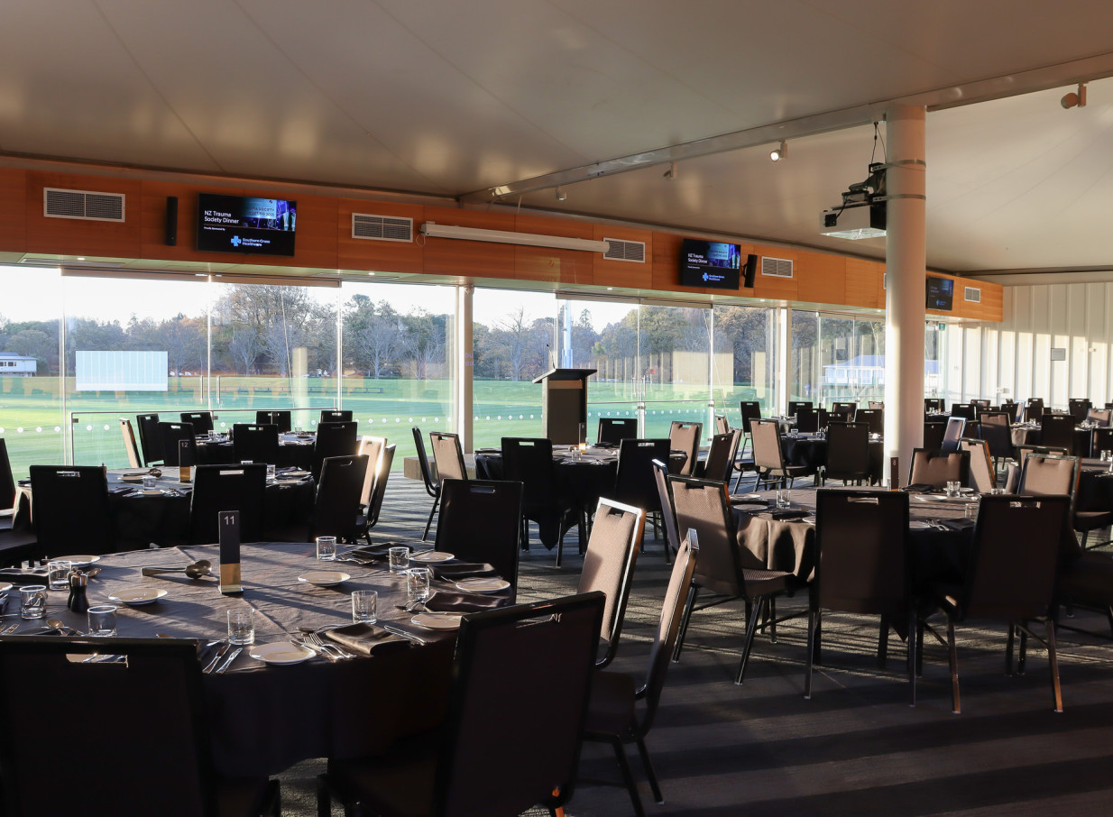 The modern Hadlee Pavilion at Hagley Oval, Christchurch, offers a luminous event space with dinner seating and panoramic views of the cricket field.