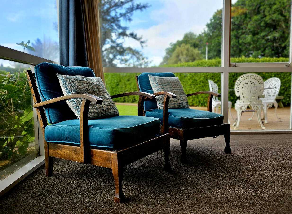 An elegant indoor seating area at LaValla Estate, Auckland, showcasing its blend of historic charm and modern design.