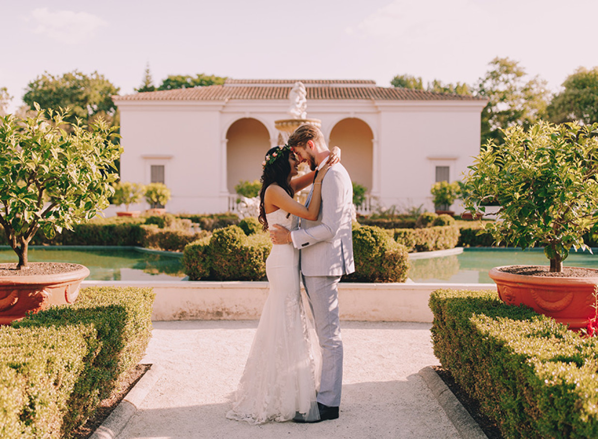 A couple embraces in the Italian Renaissance Garden at Hamilton Gardens, Hamilton.