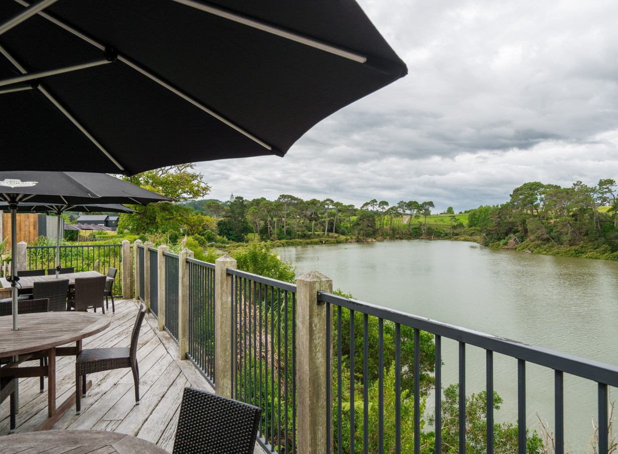 The Boat House in Auckland offers an expansive deck for outdoor dining with scenic waterfront views.