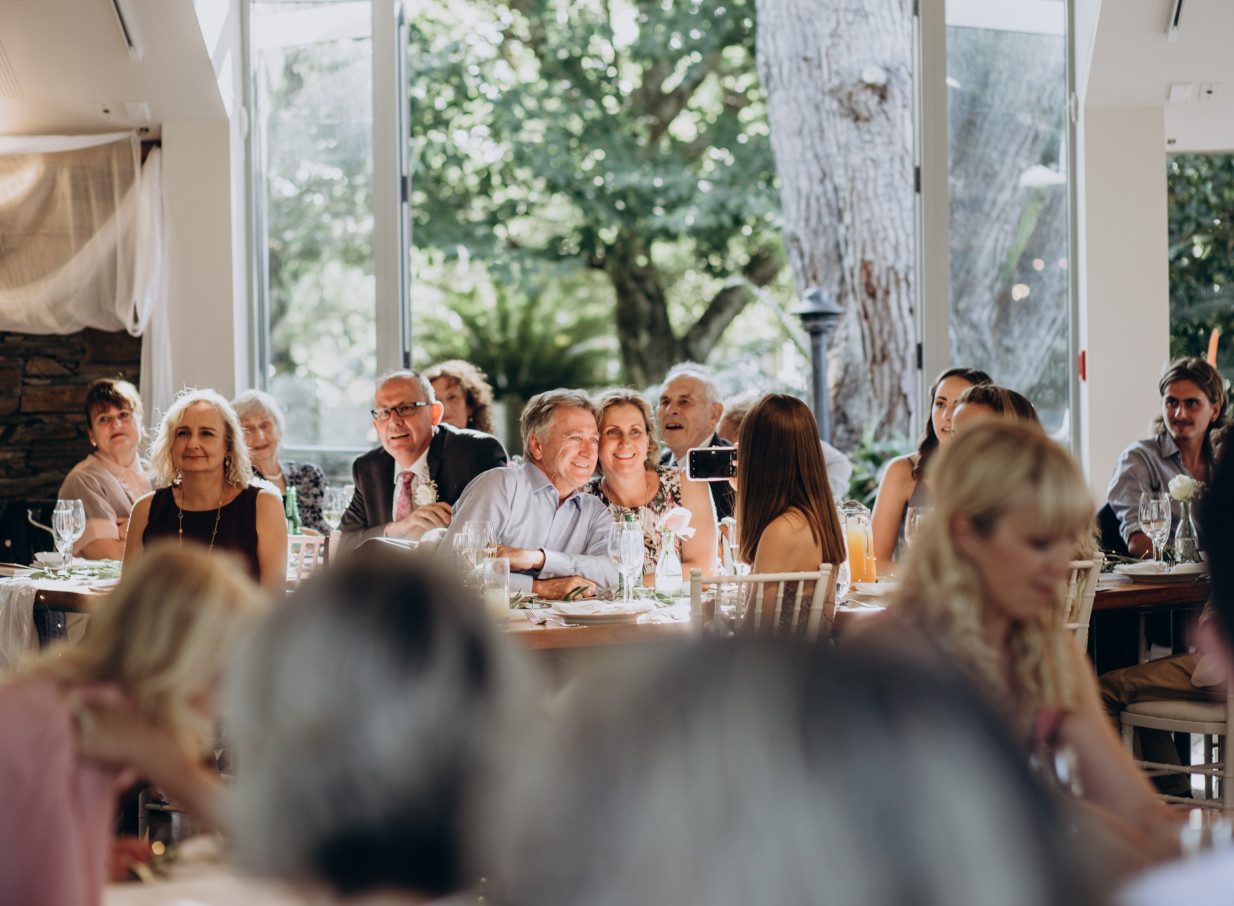 A bright, elegant indoor reception at Markovina Vineyard Estate in Auckland, featuring natural light and garden views.