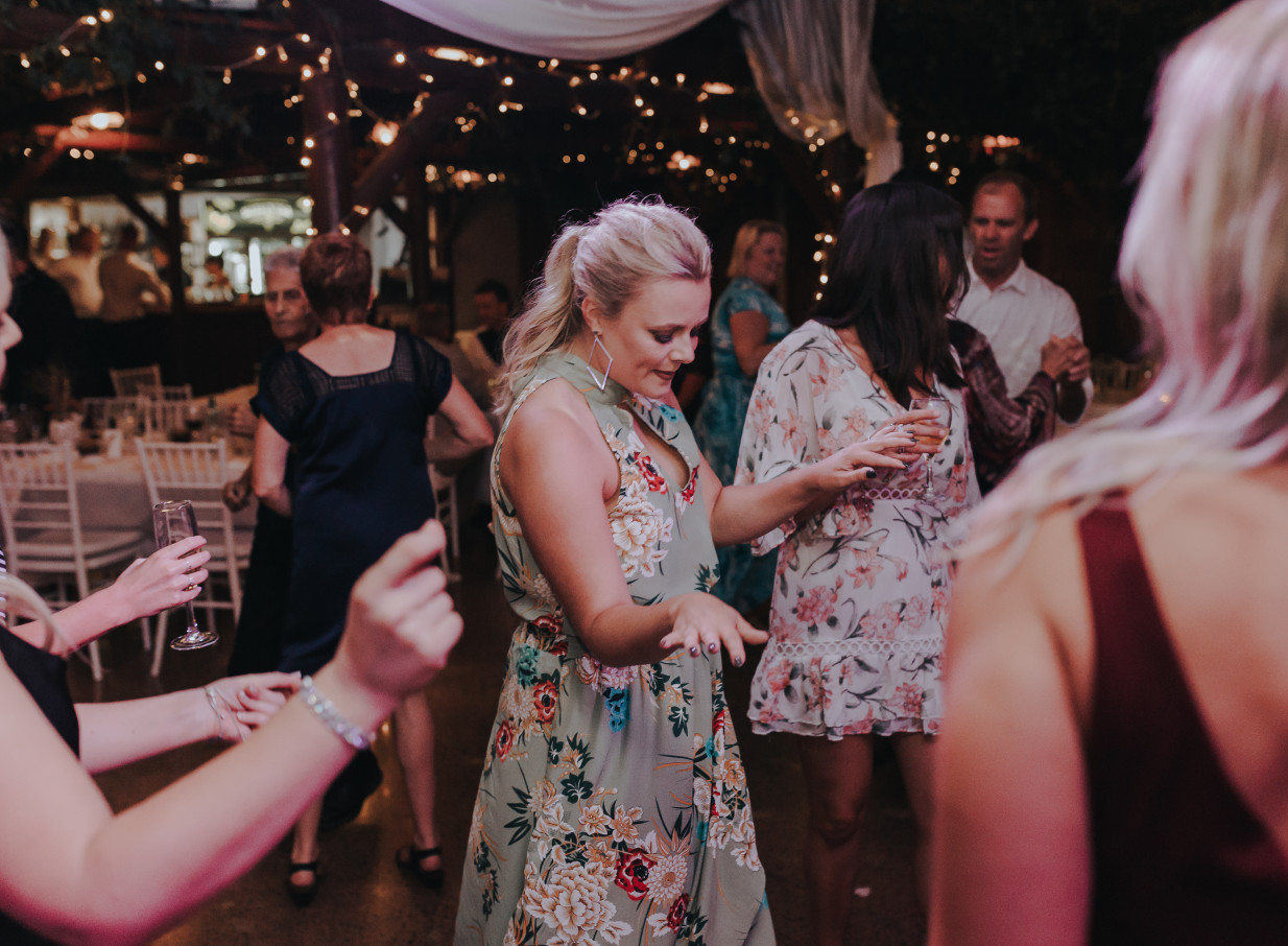 Guests dance under a canopy of fairy lights at the garden-inspired Markovina Vineyard Estate in Auckland.