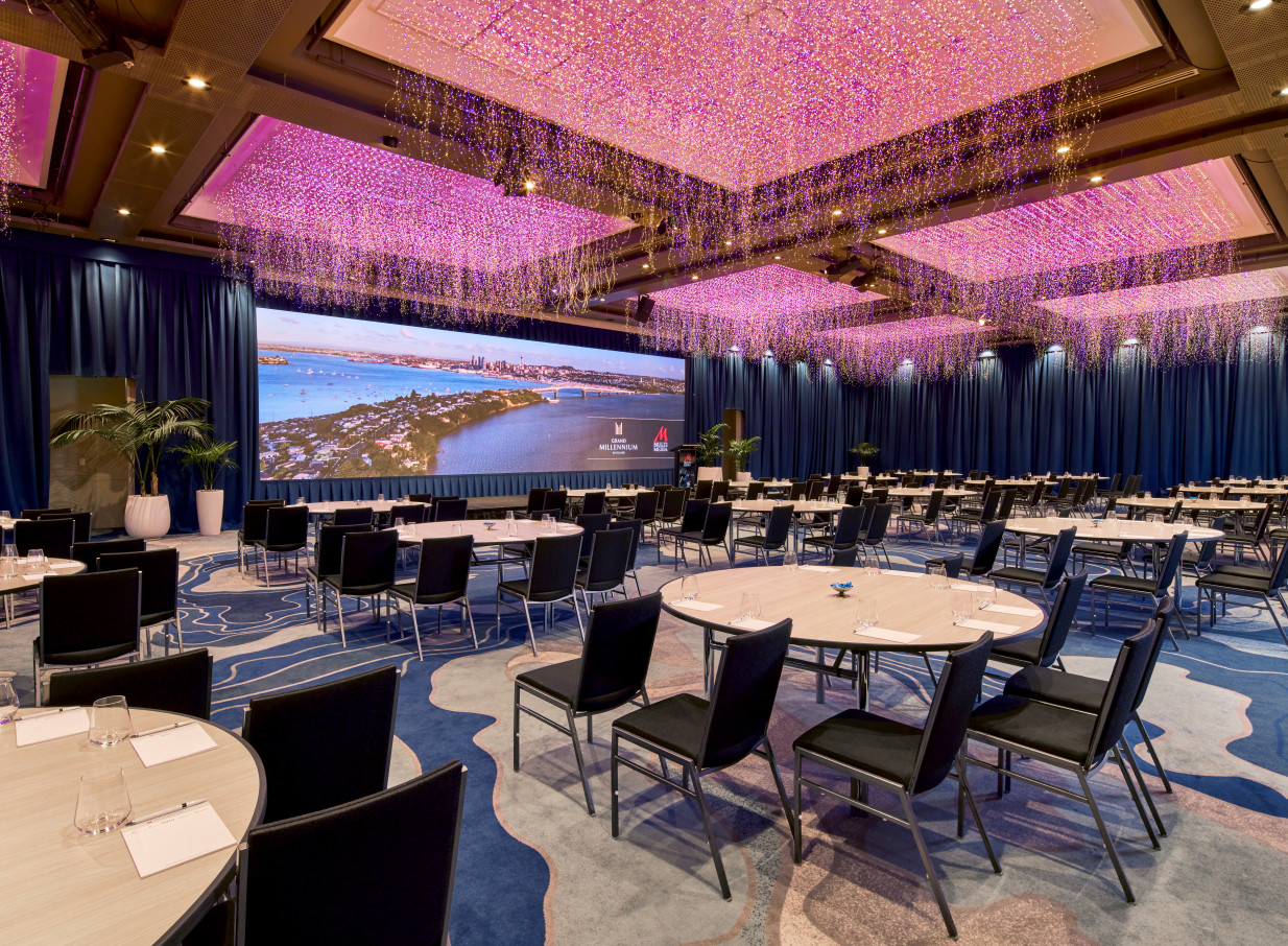 The Grand Millennium Auckland's elegant event space features a large LED screen and a dazzling "Sky Garden" ceiling sculpture.