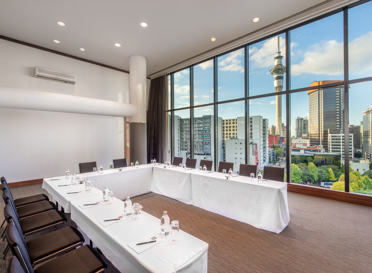 Grand Millennium Auckland's modern meeting room provides panoramic Auckland city views, complete with the Sky Tower, through its floor-to-ceiling windows.