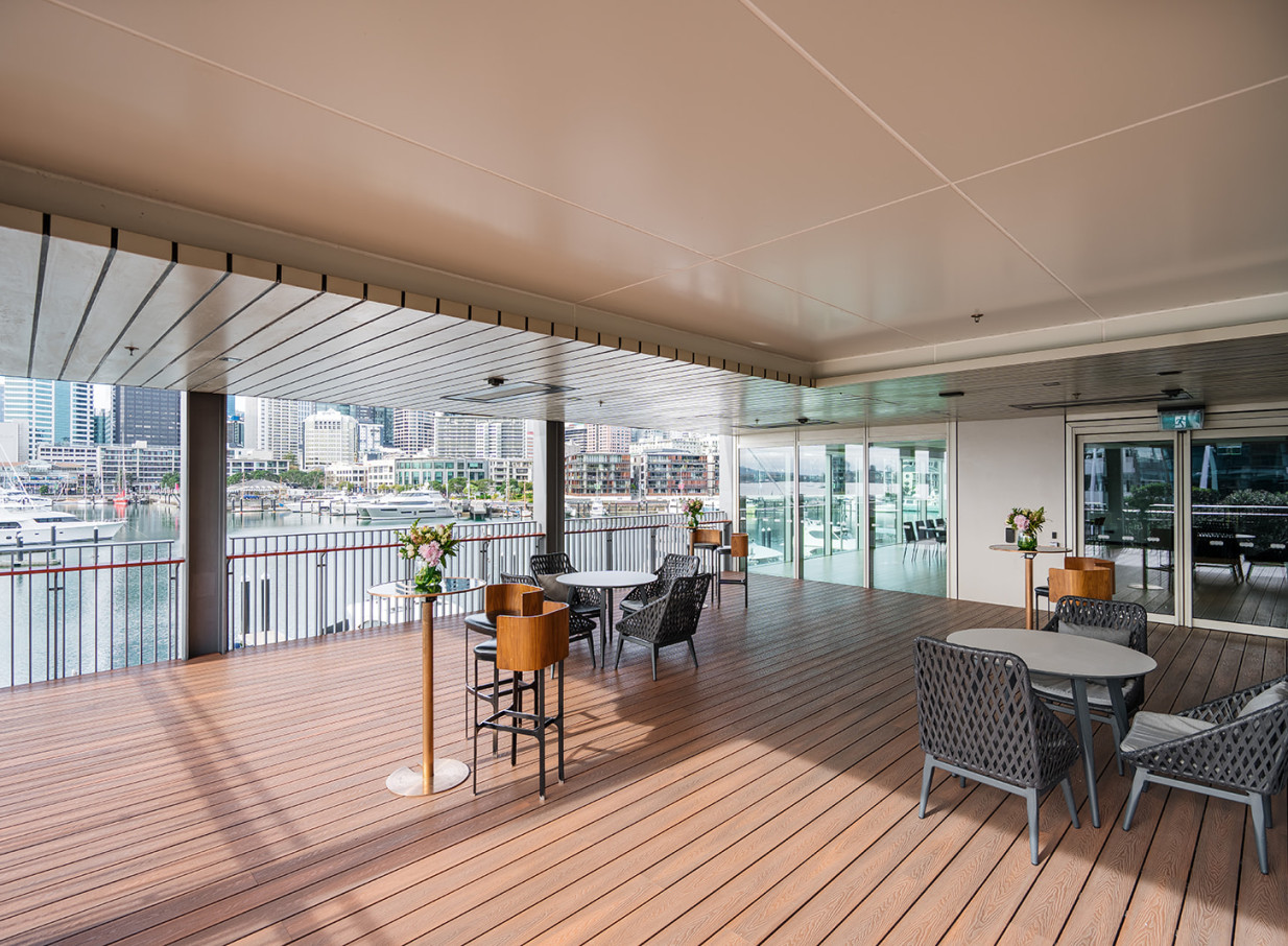 Park Hyatt Auckland's modern, cantilevered terrace offers comfortable waterfront seating with harbor views.