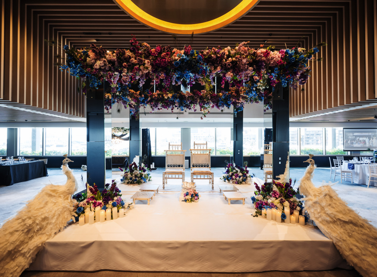 A vibrant, floral wedding ceremony in the modern and elegant event space of Park Hyatt Auckland.