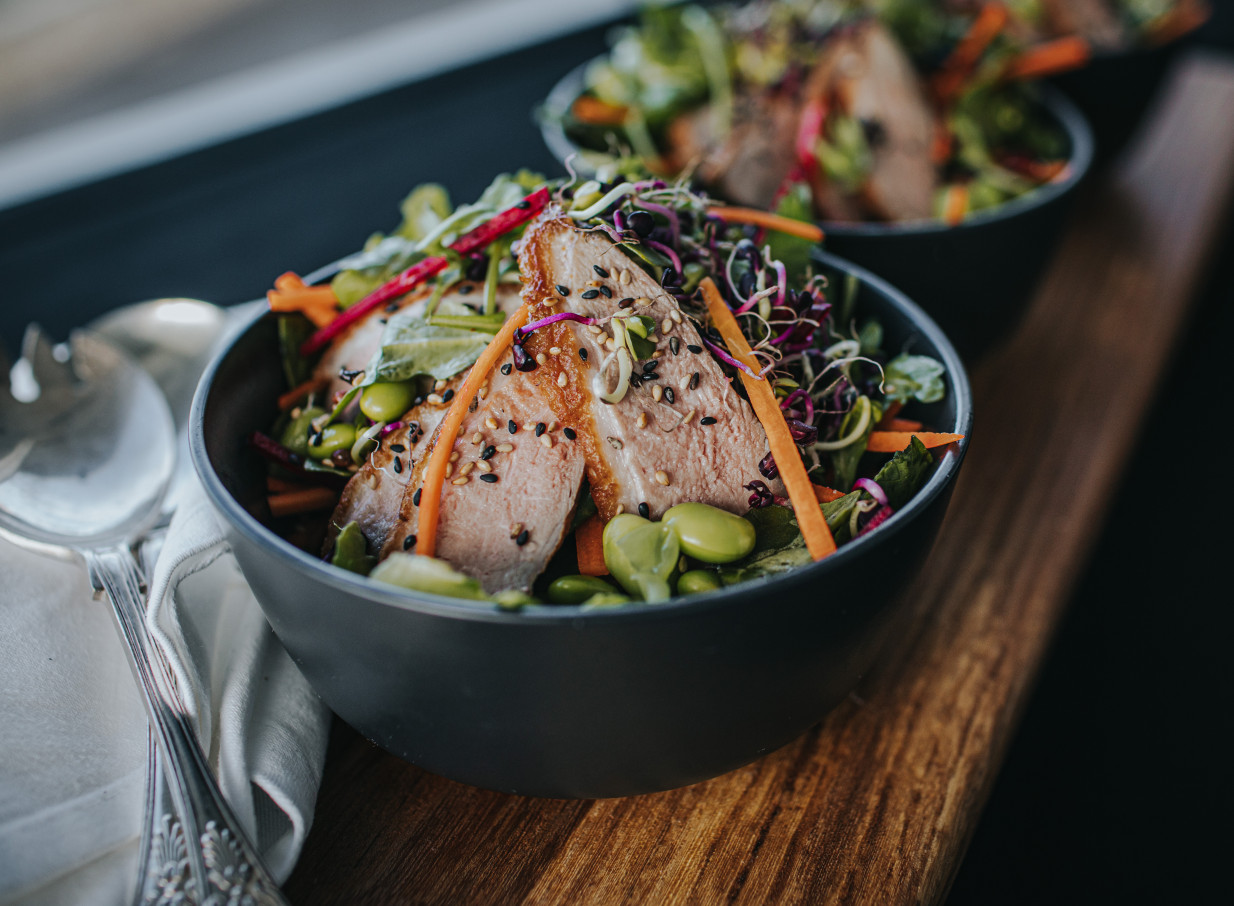 A vibrant salad with sliced meat and fresh vegetables, showcasing the delicious, freshly prepared cuisine from Napier Conferences & Events in Hawke's Bay.