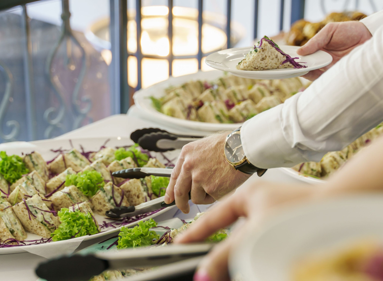 A catering buffet of sandwiches is served in a bright function room at the Parkside Hotel and Apartments, Auckland.