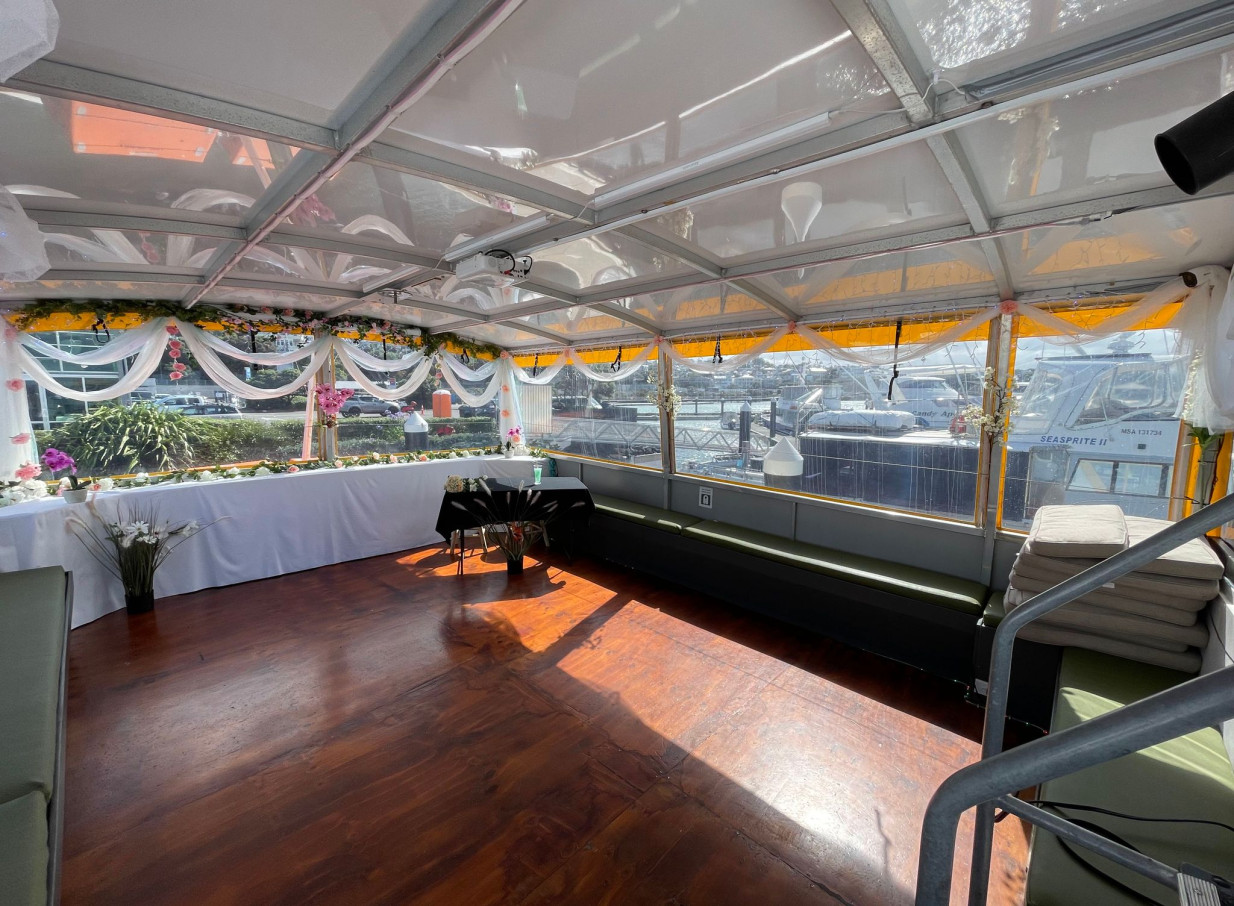 An interior event space on the Mediterranean-inspired Ocean Groove Cruises boat in Auckland, decorated for a celebration.