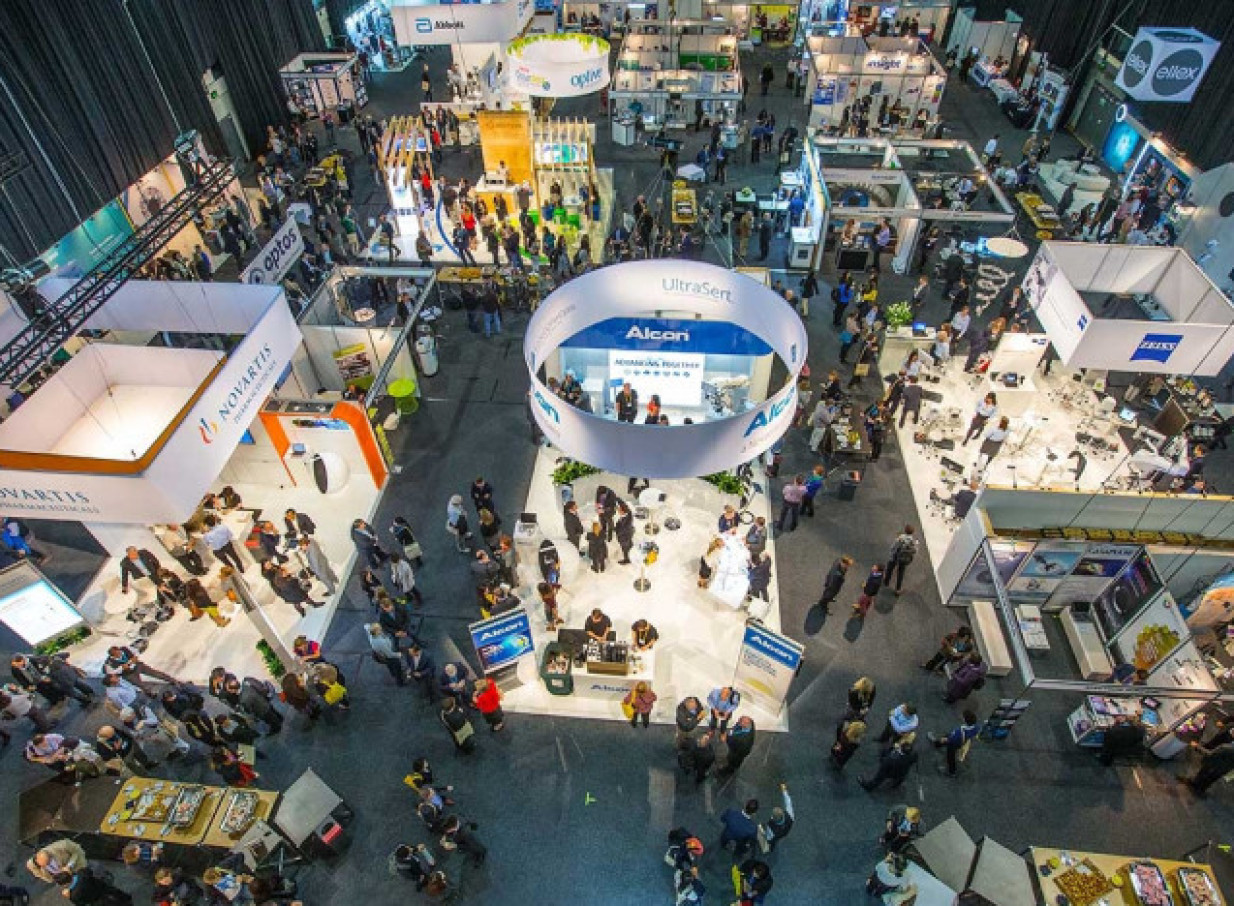 Attendees explore a bustling exhibition within the spacious, modern, wharf-inspired TSB Arena event facility in Wellington.