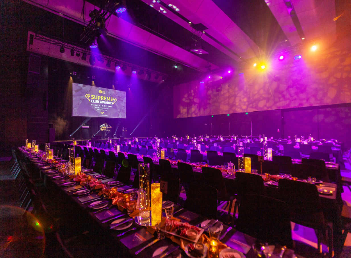 The state-of-the-art Haere-Roa in Christchurch hosts a modern awards ceremony with dramatic lighting and long banquet tables.