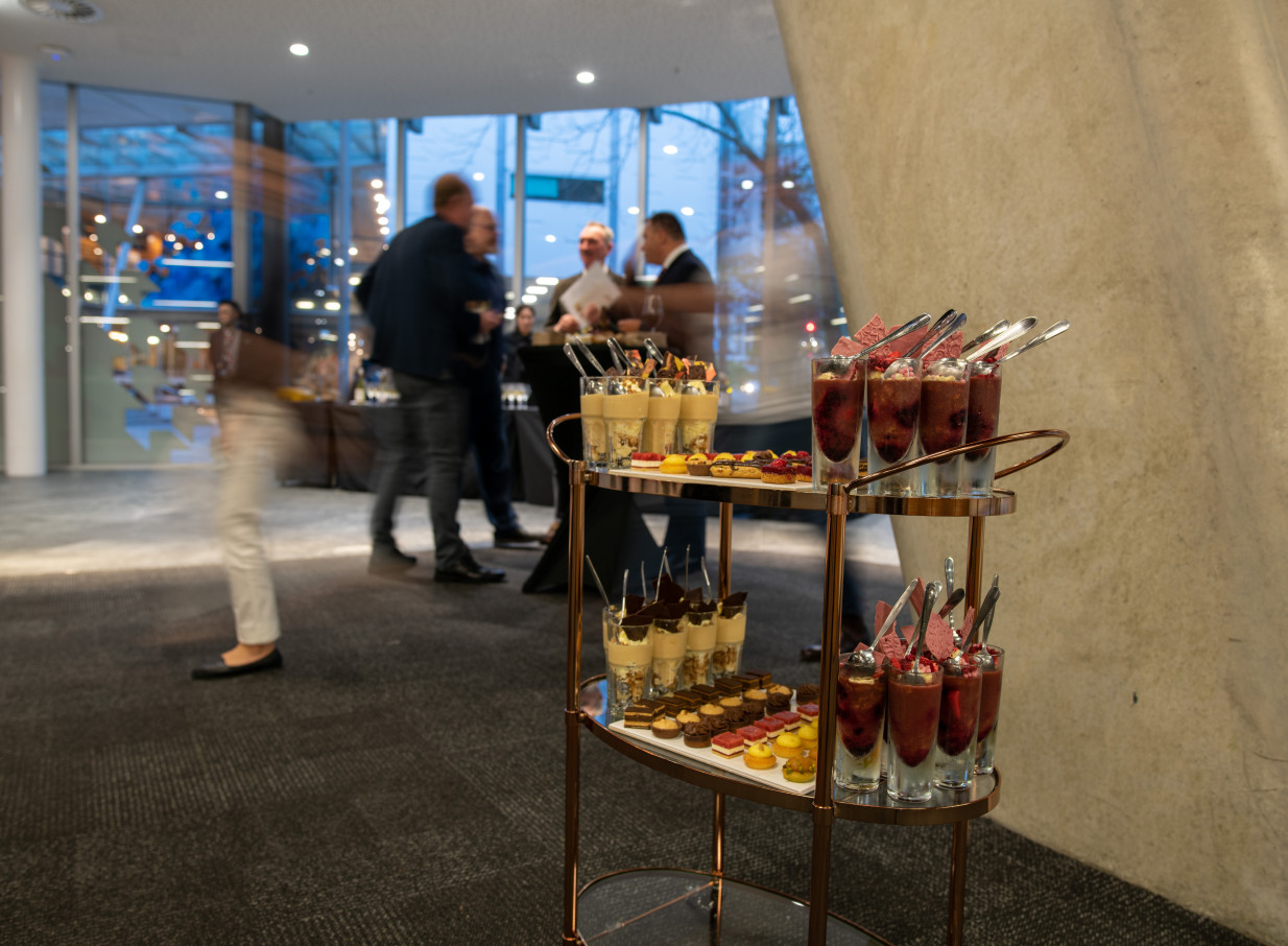 Guests enjoy a dessert reception in the modern, architecturally striking event space at AUT Events Venues, Auckland.