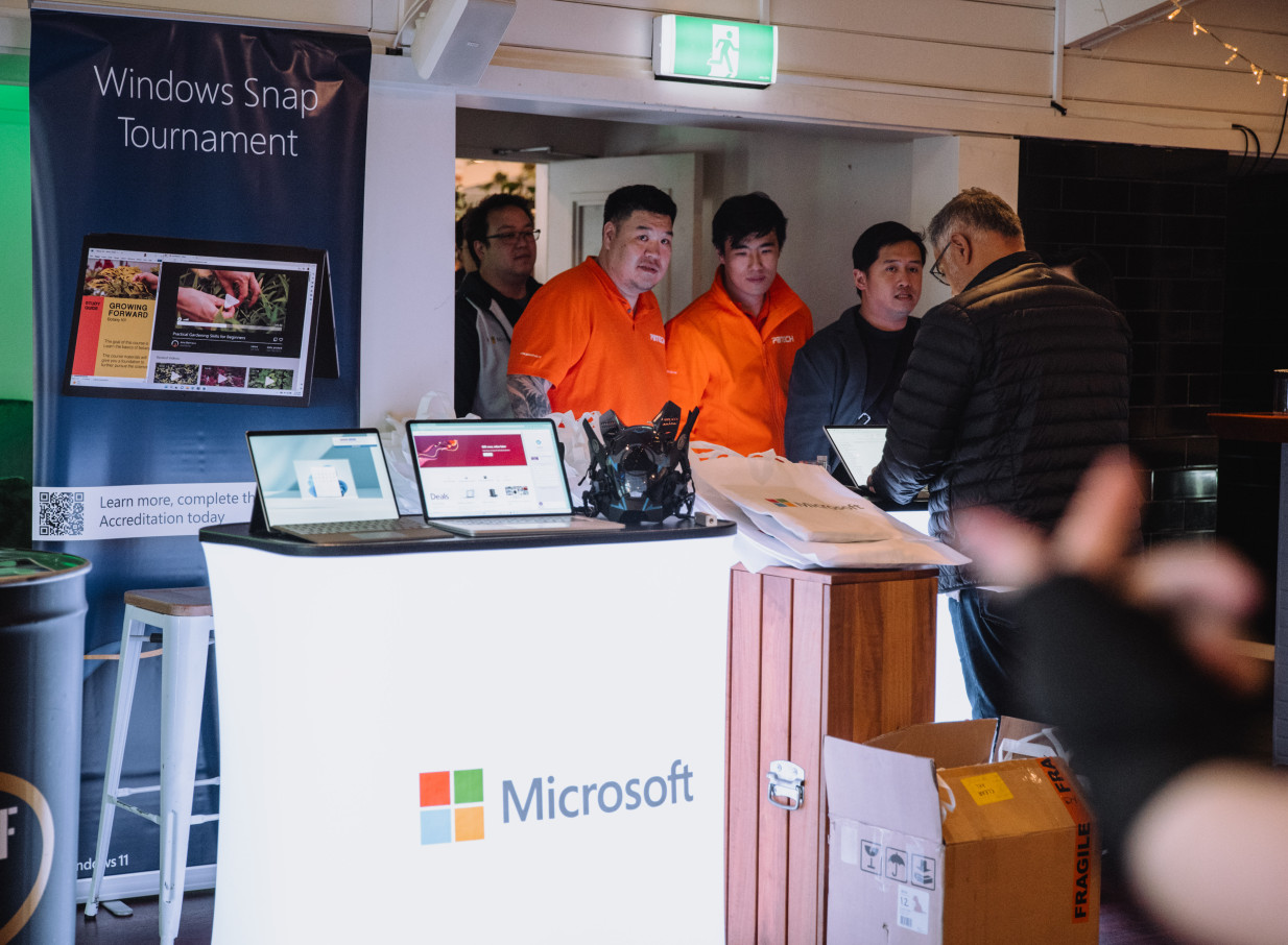 An indoor tech event booth at the modern Mission Bay Taproom, a sophisticated Auckland eatery.